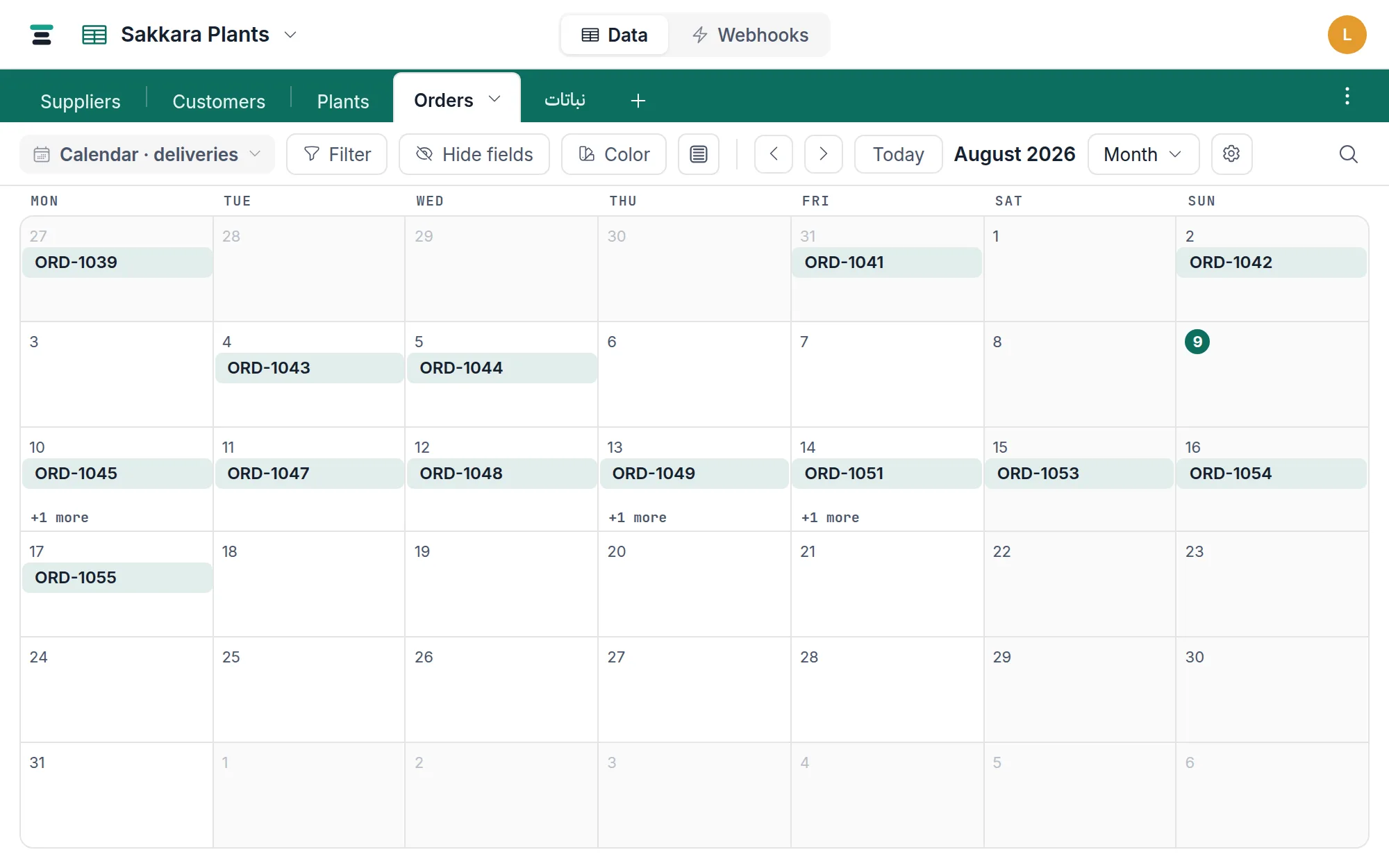 The Orders calendar on a month: delivery entries sitting on their days, the range dropdown and settings gear in the view bar.