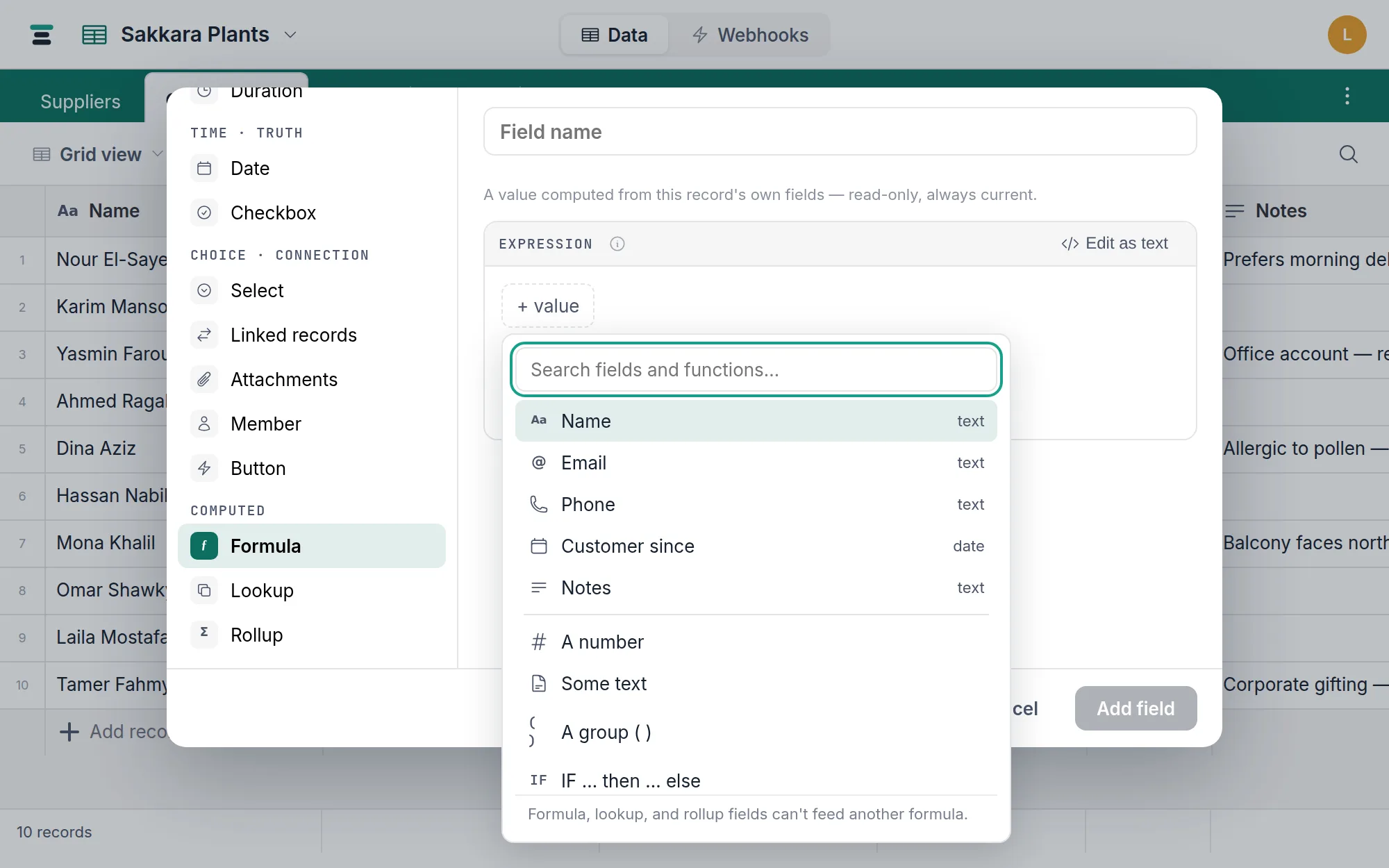 The formula builder open on the Orders table: the expression as pills, the live Reads-as line, the inferred result type, and the first record's worked answer.