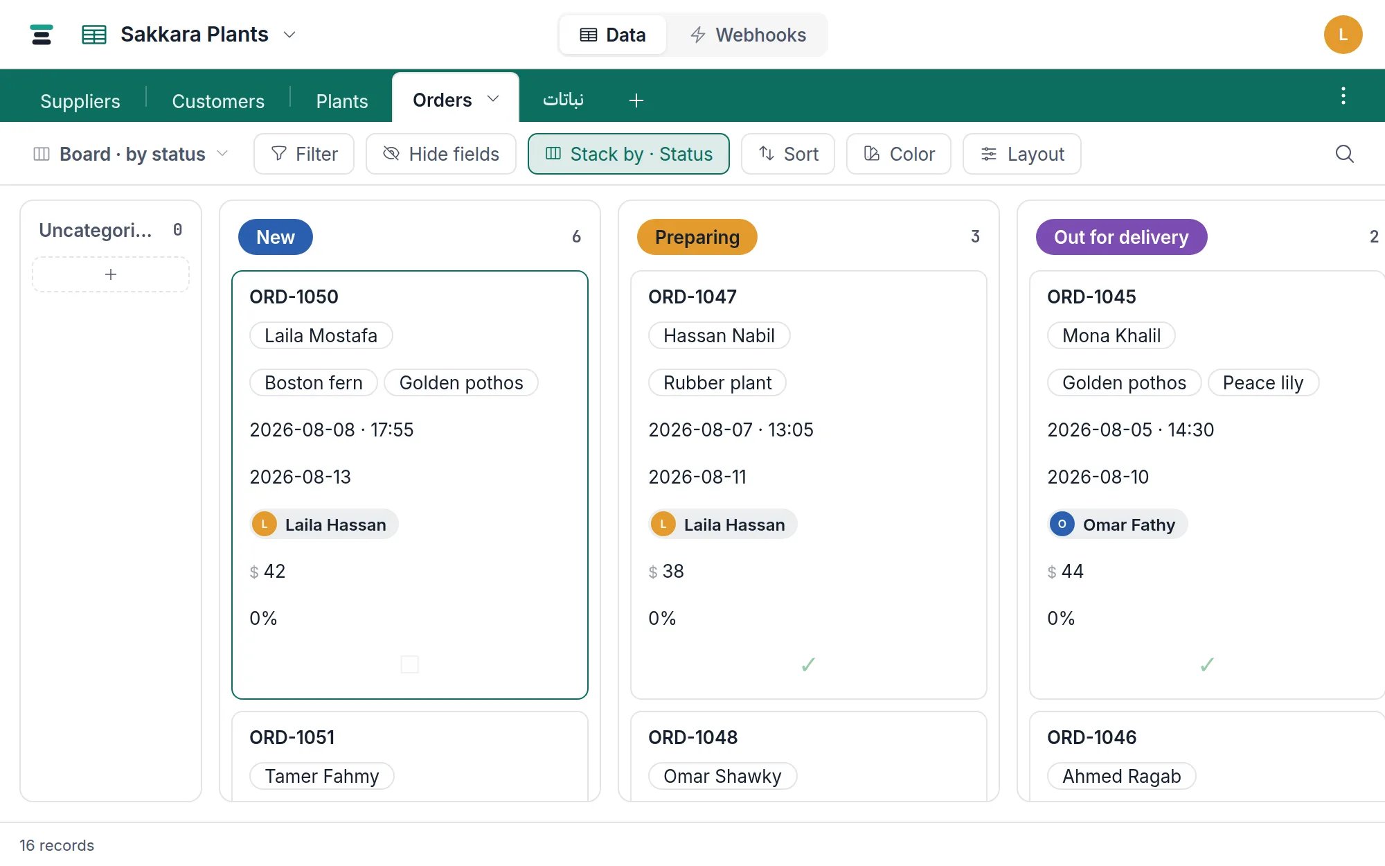 The Orders table as a grid: Status chips, currency totals, checkboxes, and the record count in the footer.