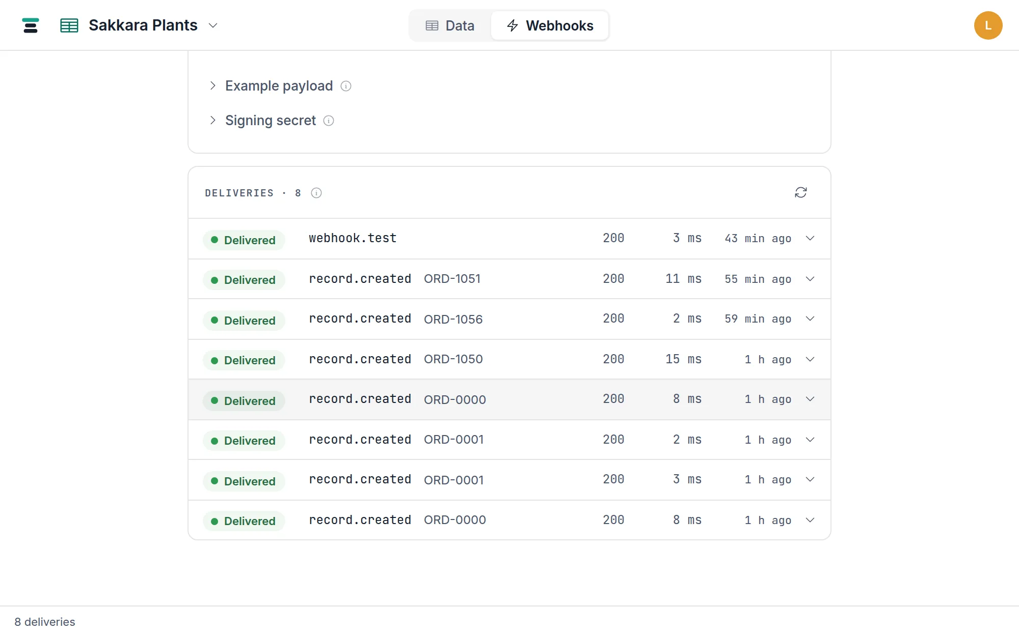 The Deliveries ledger with one delivery expanded — the Delivered chip, try 1 of 4, the SENT payload JSON, the RESPONSE with its HTTP status and duration, and the Replay button.